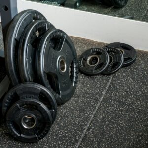 black and silver dumbbells on gray floor